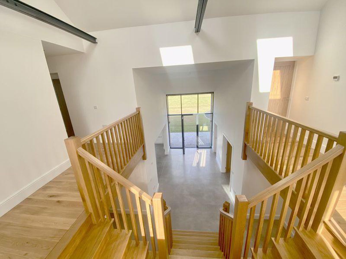 The view from the landing looking down to the entrance. Photo: James Du Pavey