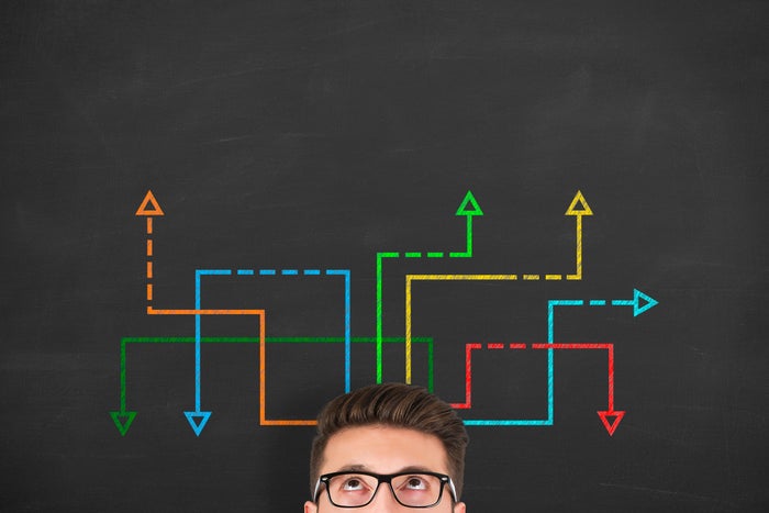 Colored arrows rise from a person's head.