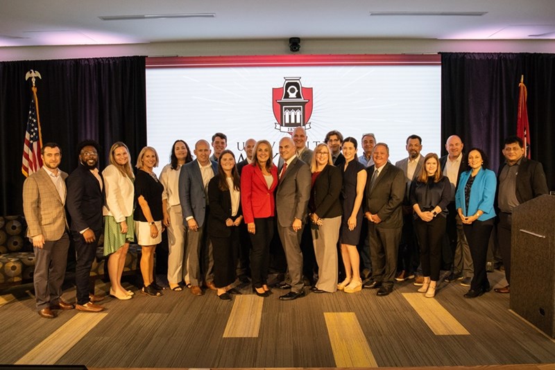 Representatives from J.B. Hunt Transport Services and the Sam M. Walton College of Business announce the newly renamed J.B. Hunt Transport Department of Supply Chain Management on the U of A campus.