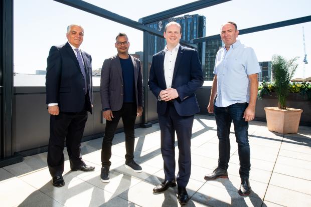 Mel Chittock, interim CEO, Invest NI; Jyoti Bansal, co-founder and CEO, Harness Inc; Economy Minister Gordon Lyons; and Nick Smyth, VP of Engineering and Belfast site lead, Harness Inc.