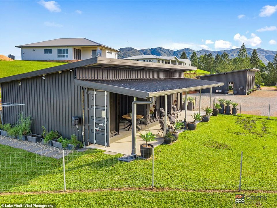 A one-of-a-kind home with an open-air lounge room has been created out of three transformed shipping containers that now house a custom kitchen and two bedrooms