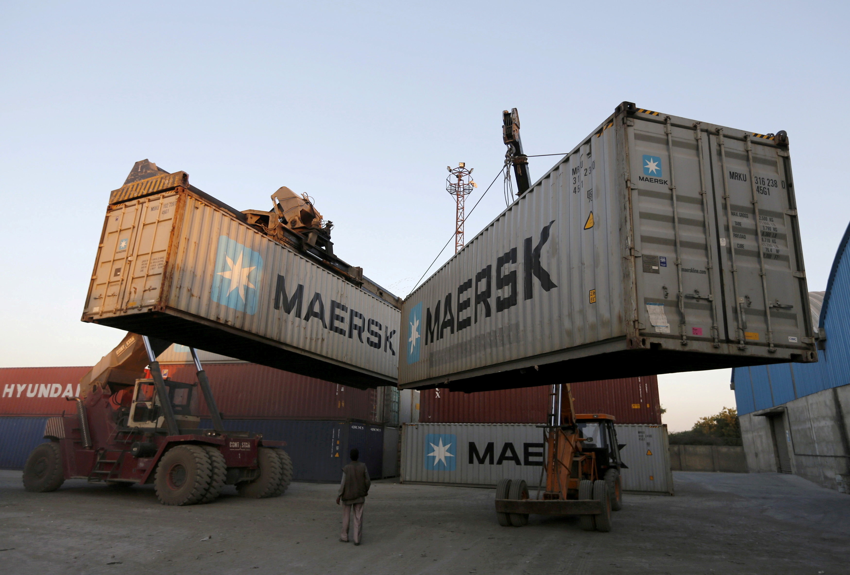 Mobile cranes prepare to stack containers at Thar Dry Port in Sanand