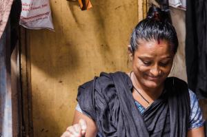 The Exodus Road photo of Indian woman looking down smiling