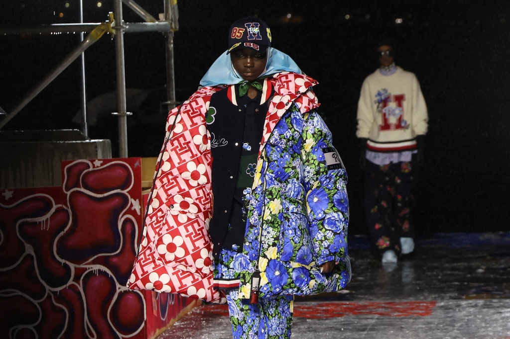 Anyiang walks the runway at the Tommy Factory.