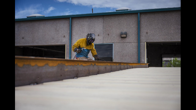 Dan Caspi welds areas of a shipping container at Maloy Mobile Storage in Albuquerque, N.M., on Tuesday, Sept. 13, 2022. Pat and Mary Beth Maloy established their business in 1988 and specialize in custom modifying and manufacturing storage containers for government and commercial use. (Chancey Bush/Albuquerque Journal)