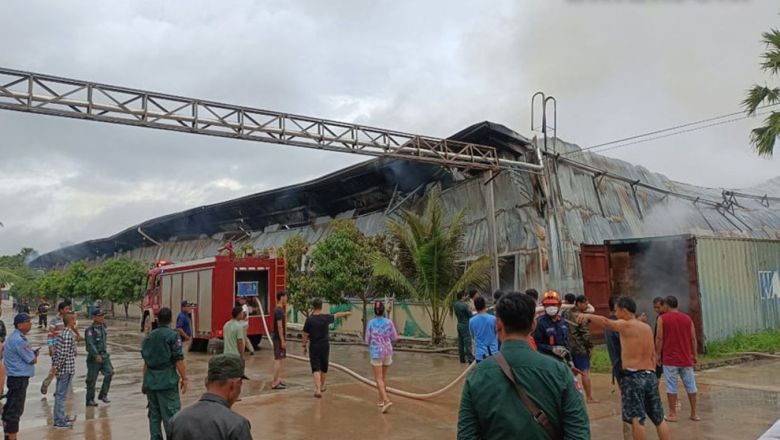 Officers are seen in the aftermath of the fire in Prey Vihear commune of Kampong Speu province's Kong Pisey district. NATIONAL POLICE Content image - Phnom Penh Post
