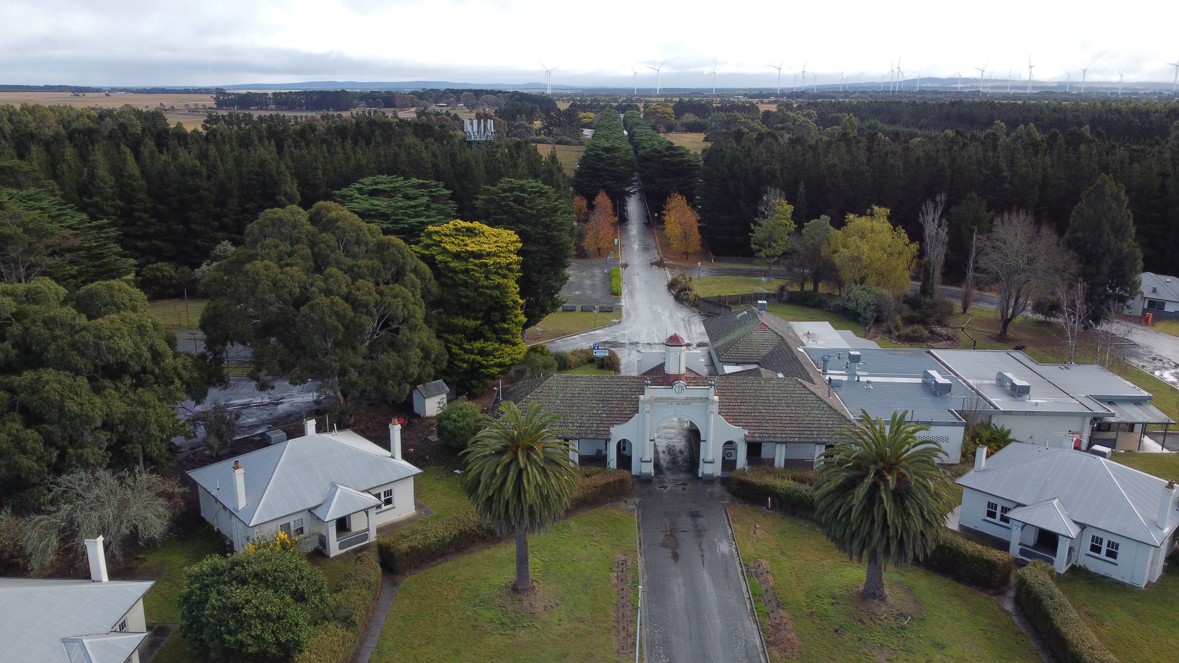 Aerial view of the Fiskville training facility surrounded by trees and grass fields