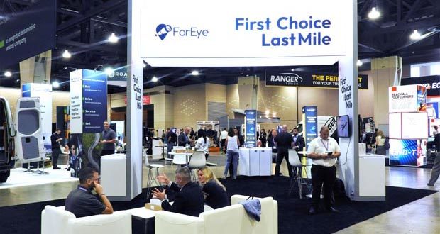Floor of a convention center with a large sign that reads "First Choice Last Mile"