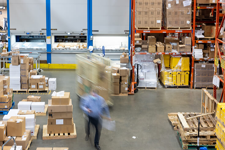 An overhead shot of a busy warehouse floor.
