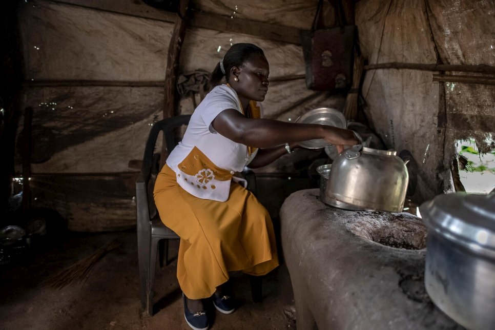 Anyek Rose John, founder of the Magwi Payam Women's Association, prepares breakfast for patrons of her restaurant at Magwi trading centre. 