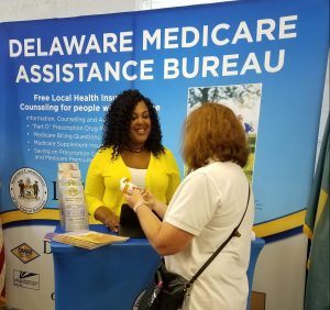 DMAB Director Lakia Turner talking to a consumer