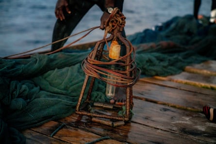The light that the fishers suspend under their boat to attract plankton