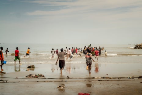A fishing boat reaches the shore, Cape Coast, Ghana