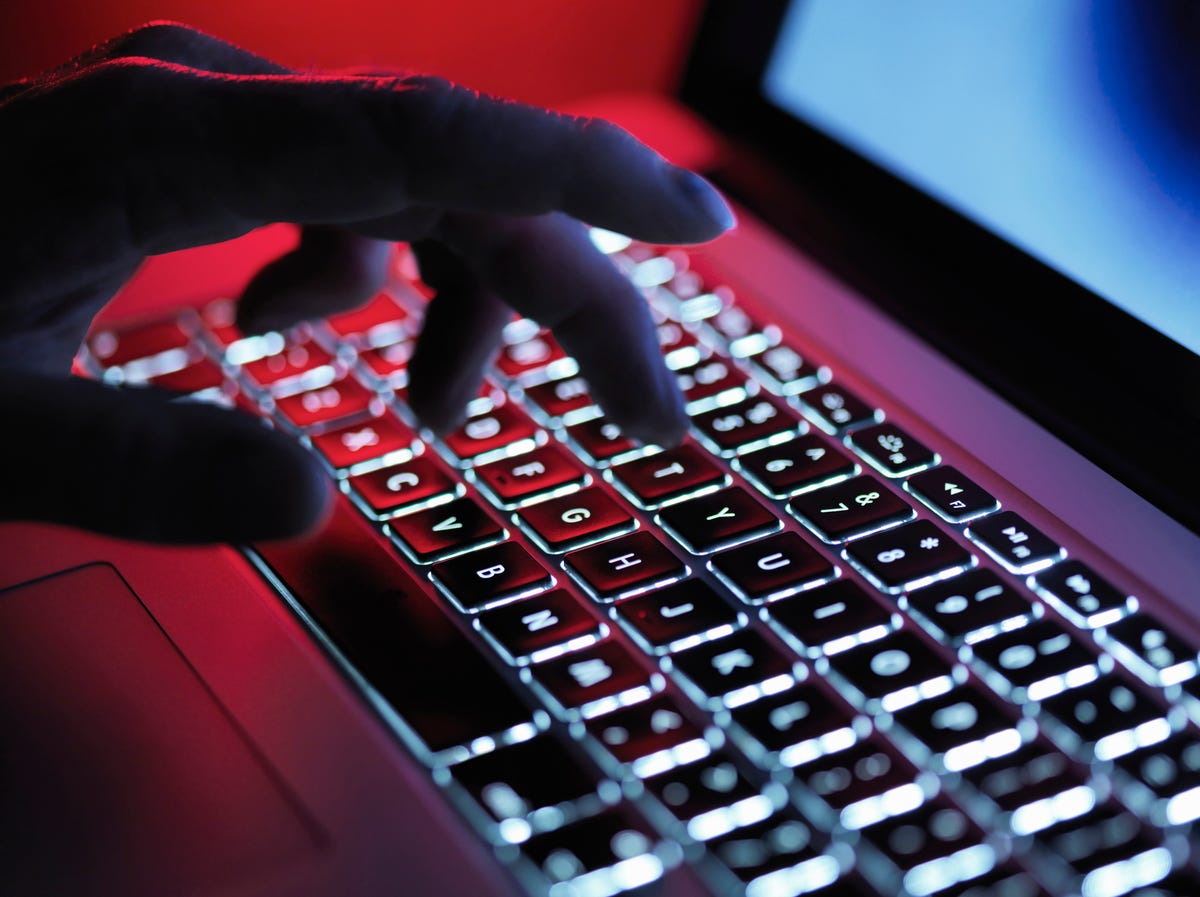 Hand typing on a keyboard.